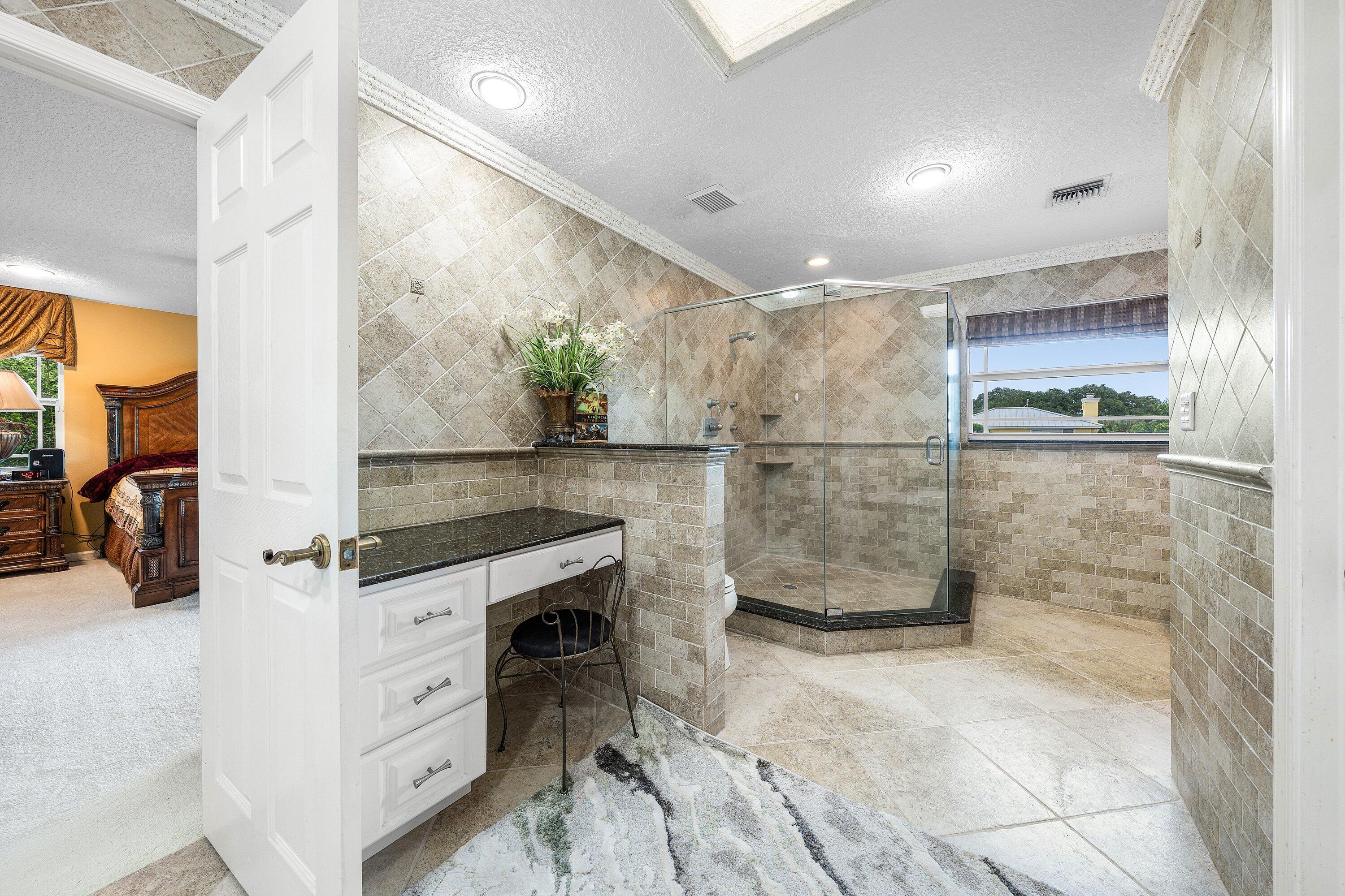 1548 Southwest 5th Avenue Boca Raton, FL 33432 - Photo 48 of 64 a kitchen with stainless steel appliances kitchen island granite countertop a refrigerator and a sink