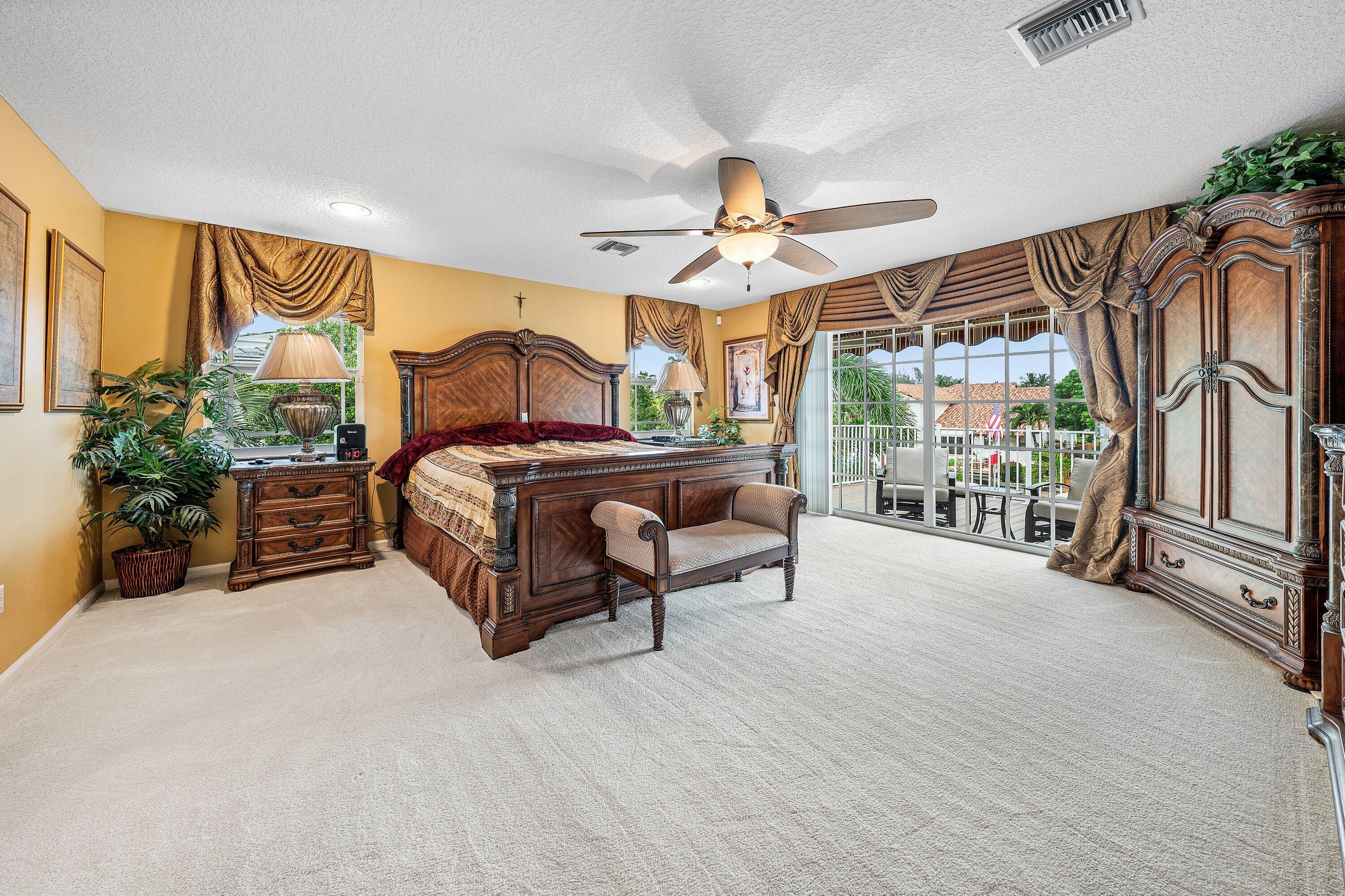 1548 Southwest 5th Avenue Boca Raton, FL 33432 - Photo 51 of 64 a bedroom with furniture and a large window