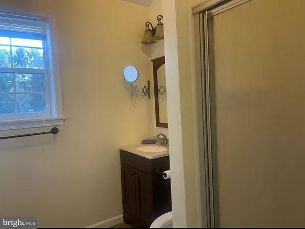 a bathroom with a sink and mirror