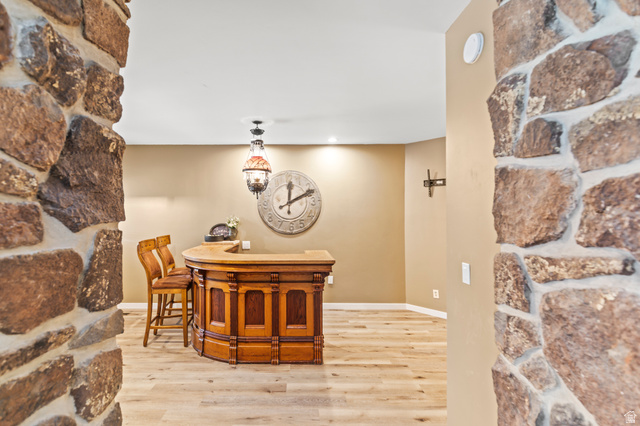 460 Omni Point Road Central Valley, UT 84754 - Photo 14 of 101 Built-in antique wooden judeges bench from the original sevier county courthouse, The bar top is sealed wood. recessed lighting, and stone columns