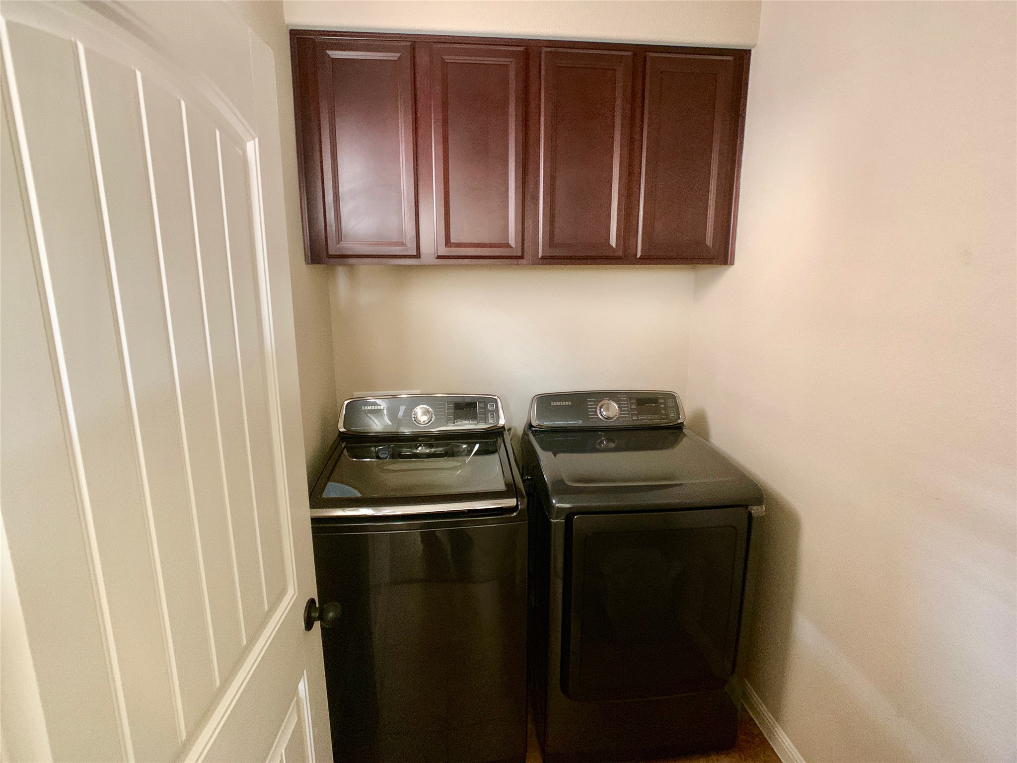 14001 Avery Ranch Boulevard, Unit 1204 Austin, TX 78717 - Photo 9 of 18 a view of a kitchen with stainless steel appliances wooden floor washer and dryer