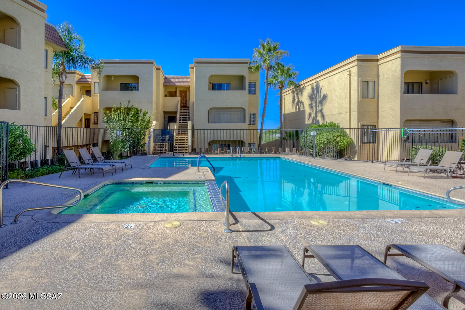 5500 North Valley View Road, Unit 123 Tucson, AZ 85718 - Photo 35 of 36 a view of a house with a swimming pool