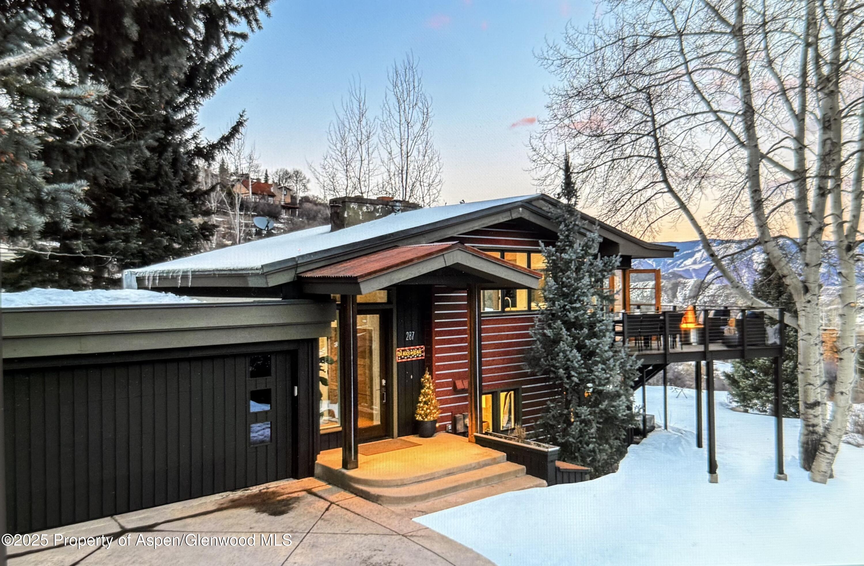 287 Meadow Road Snowmass Village, CO 81615 - Photo 1 of 20 a front view of a house with a yard