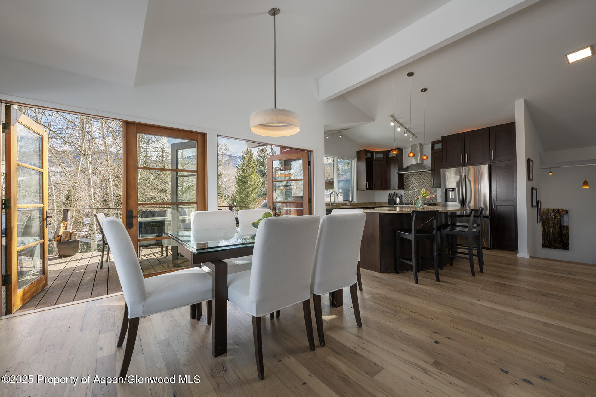 287 Meadow Road Snowmass Village, CO 81615 - Photo 12 of 20 a view of a dining room with furniture window and wooden floor