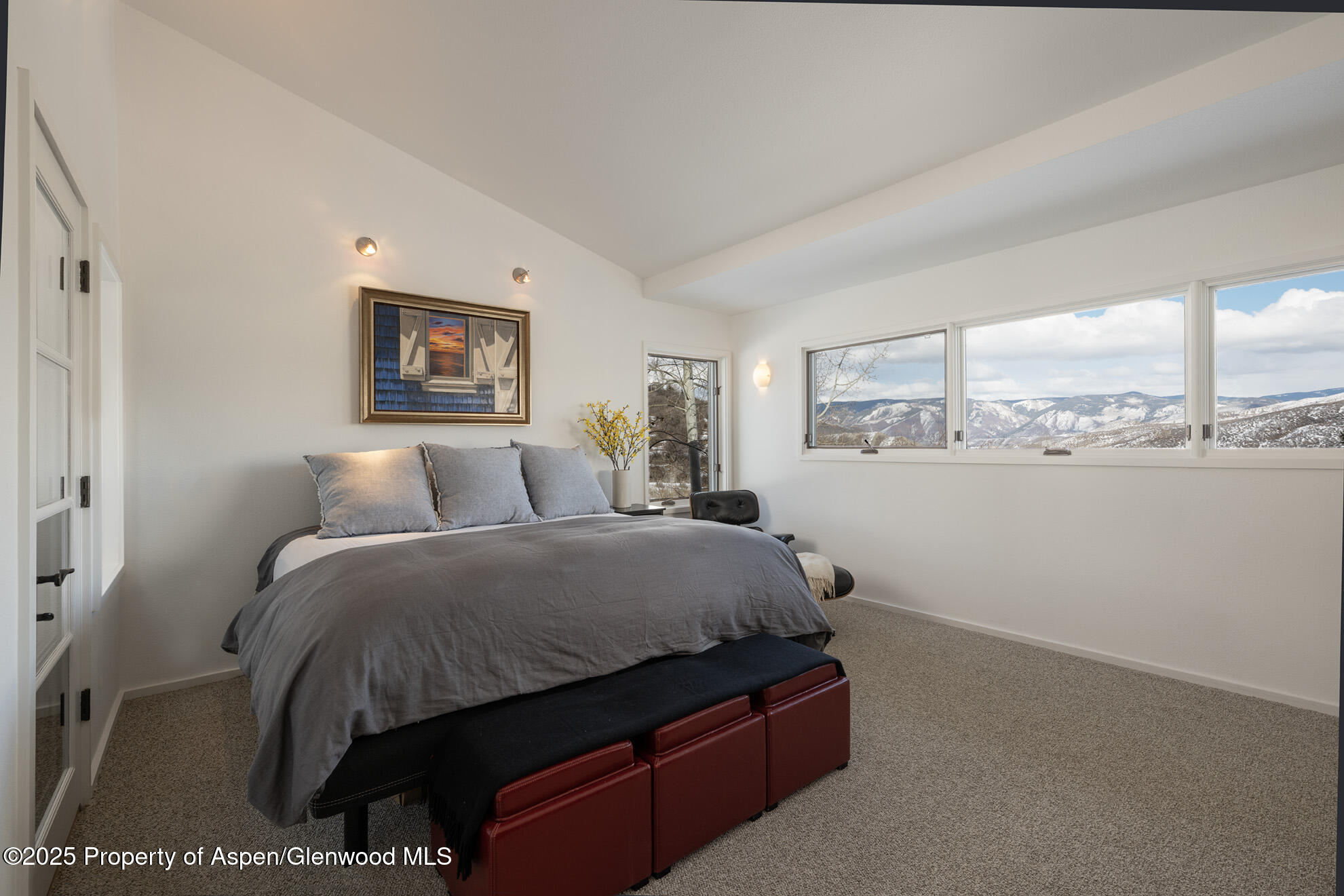 287 Meadow Road Snowmass Village, CO 81615 - Photo 6 of 20 a bed room with a bed and a painting on the wall