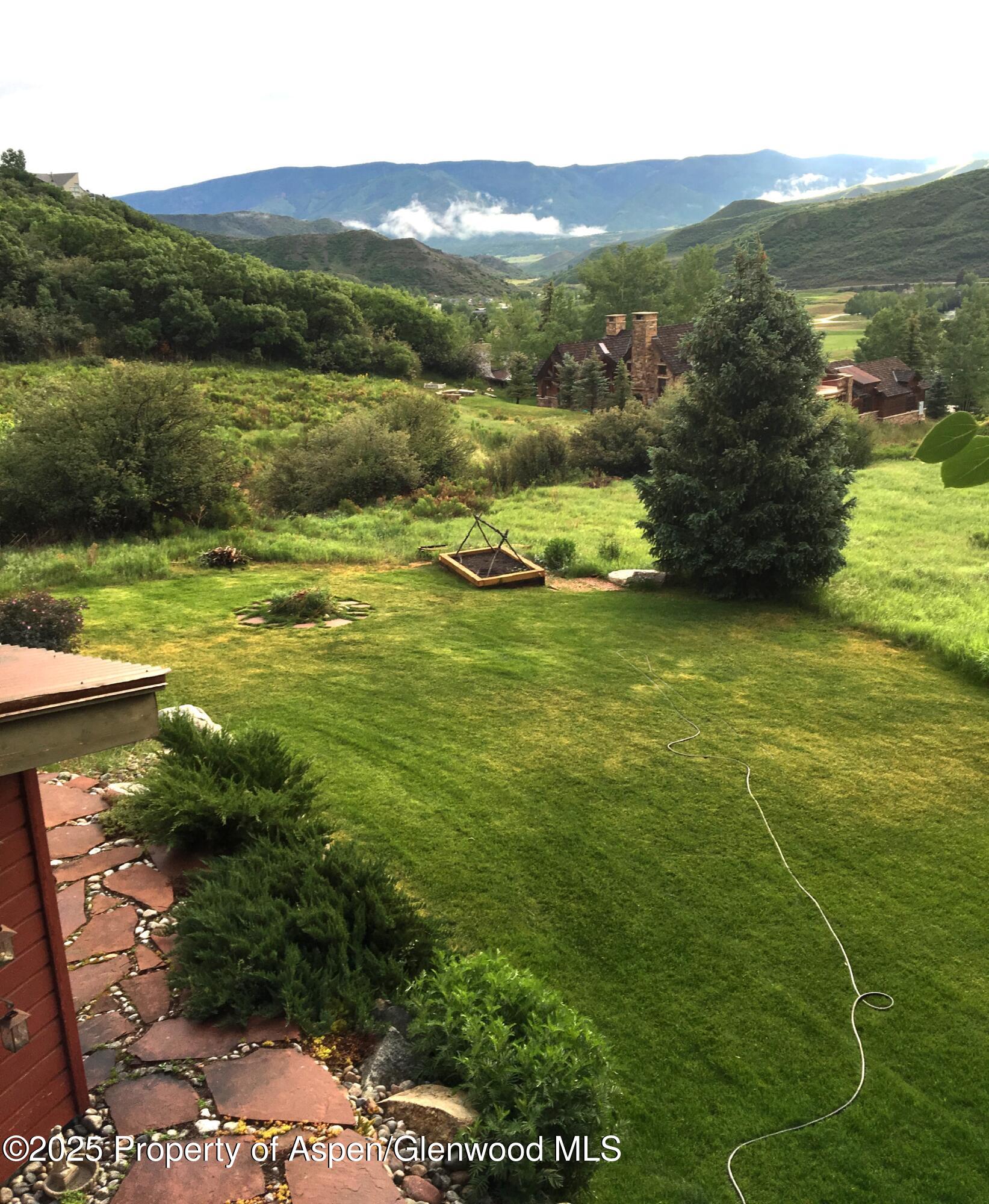 287 Meadow Road Snowmass Village, CO 81615 - Photo 9 of 20 a view of a lake with a mountain