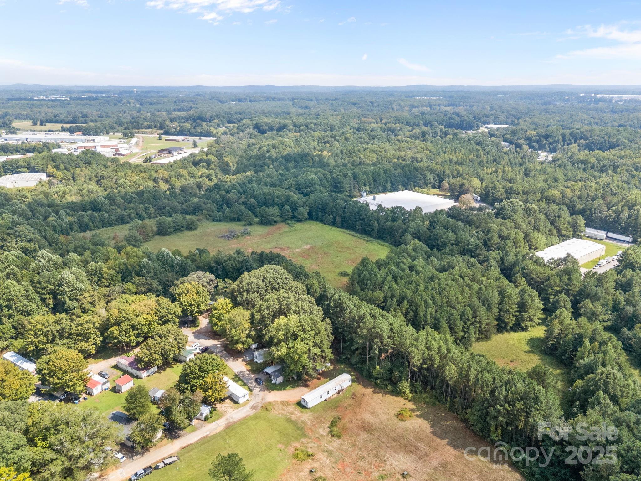 701 Airport Road Salisbury, NC 28147 - Photo 11 of 16 an aerial view of a houses with a yard and lake view