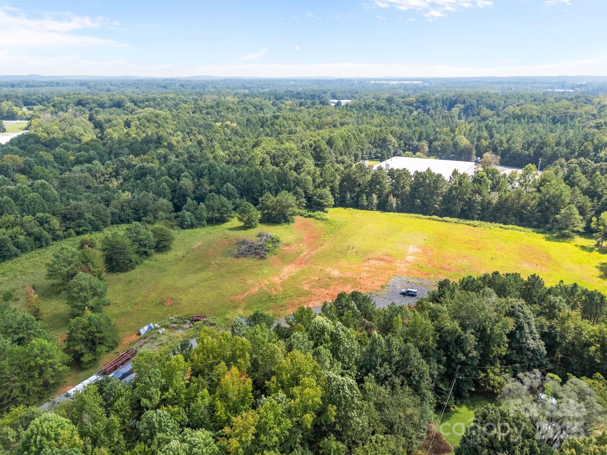 701 Airport Road Salisbury, NC 28147 - Photo 2 of 16 an aerial view of residential houses with outdoor space and trees