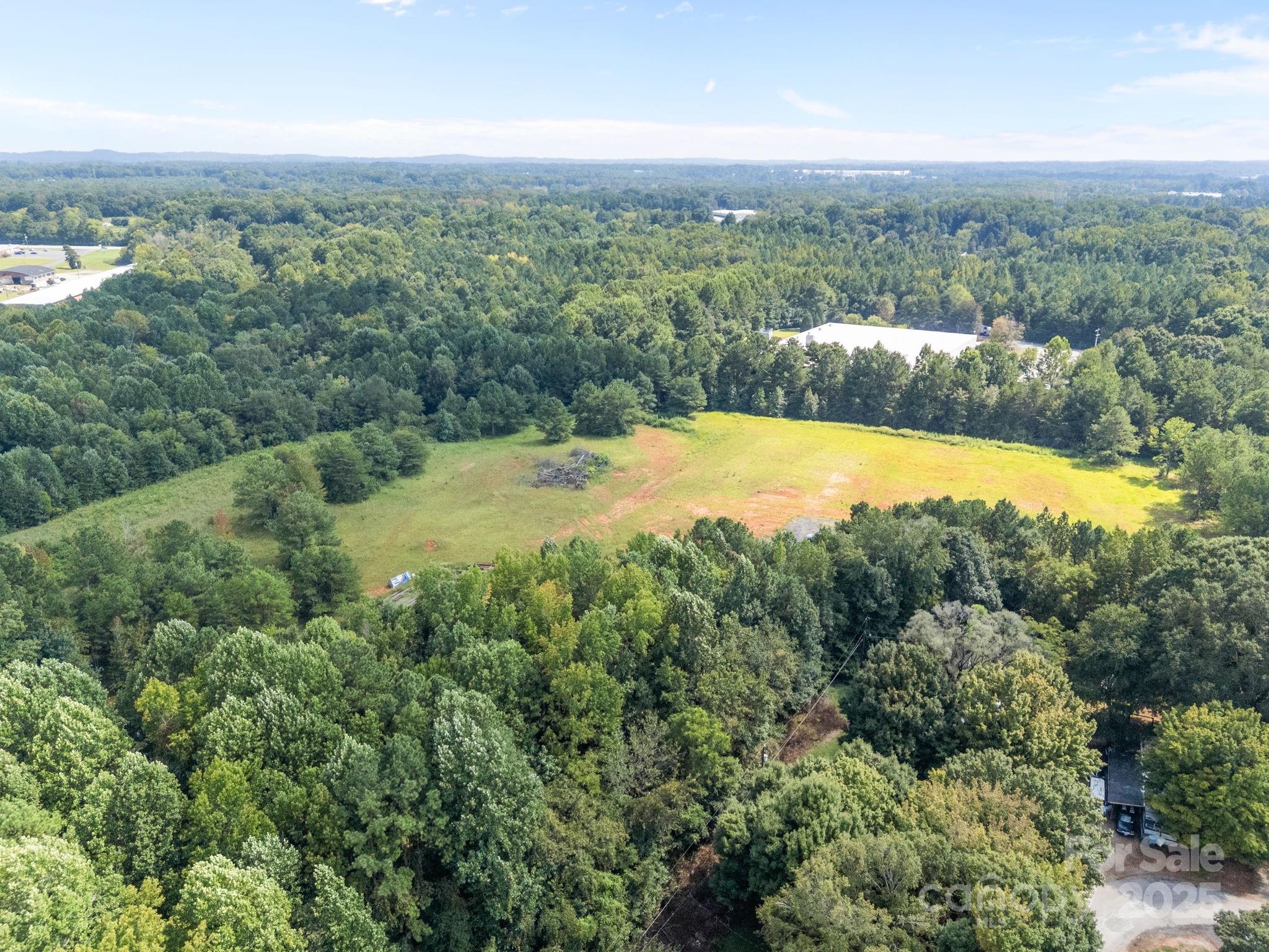 701 Airport Road Salisbury, NC 28147 - Photo 3 of 16 an aerial view of residential houses with outdoor space and trees