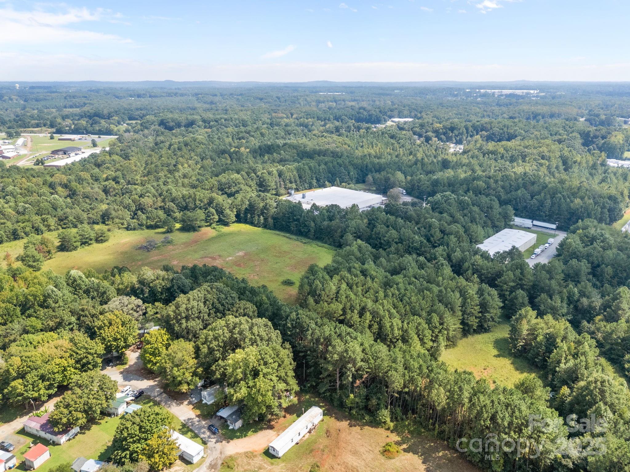 701 Airport Road Salisbury, NC 28147 - Photo 10 of 16 an aerial view of a houses with a yard and lake view