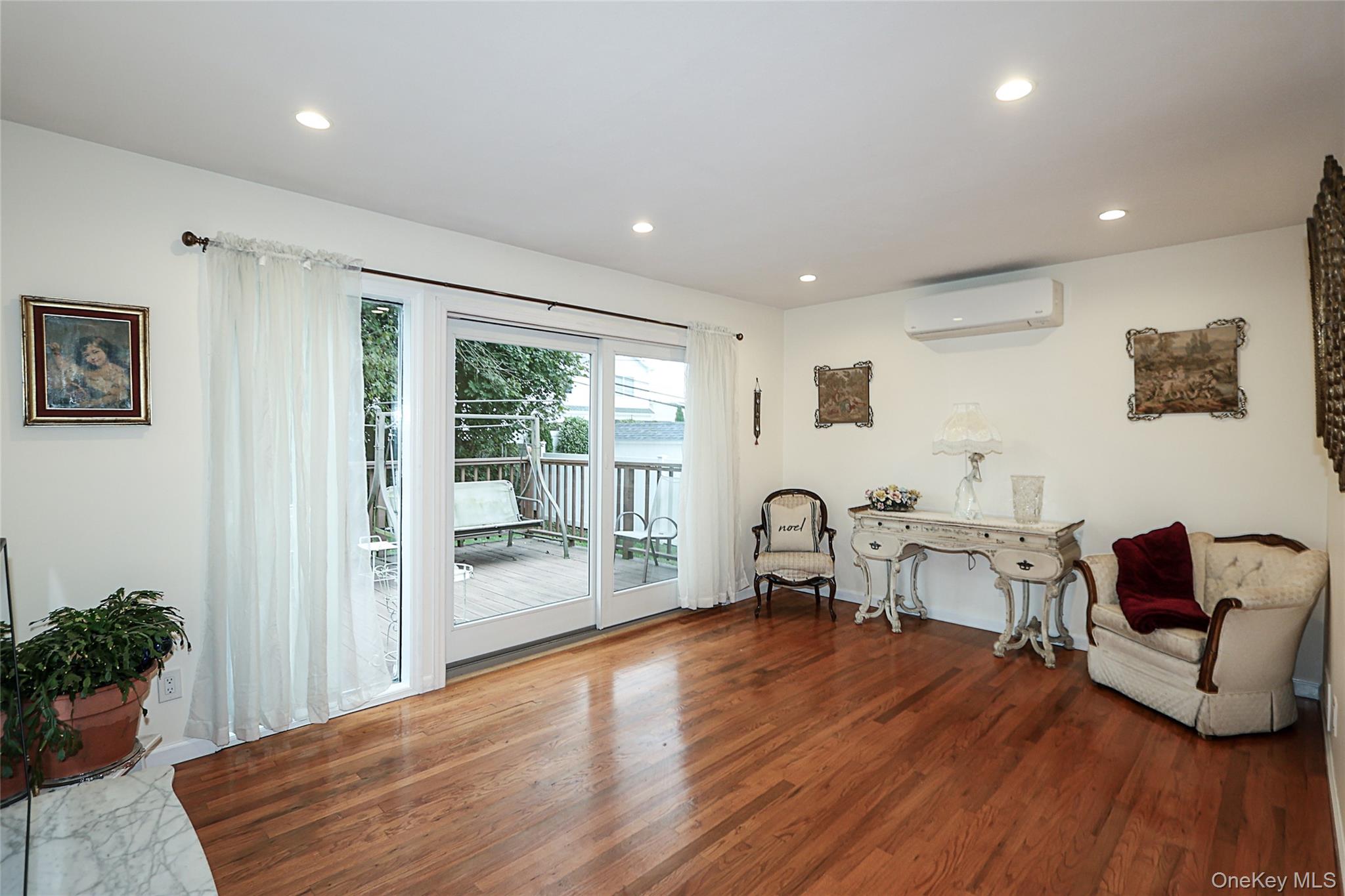 6 Gerhard Road Plainview, NY 11803 - Photo 11 of 29 a living room with furniture and wooden floor