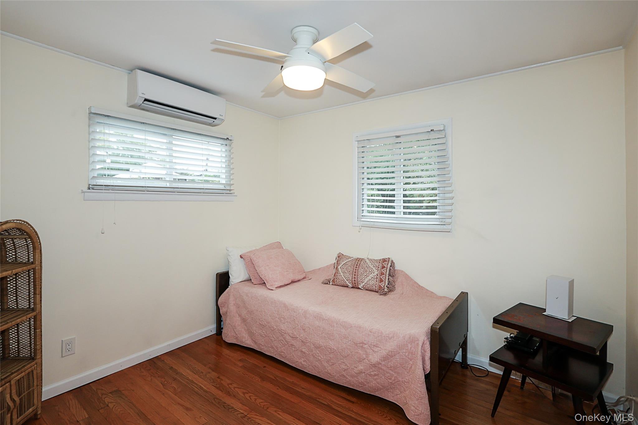 6 Gerhard Road Plainview, NY 11803 - Photo 16 of 29 a bedroom with a bed and a window