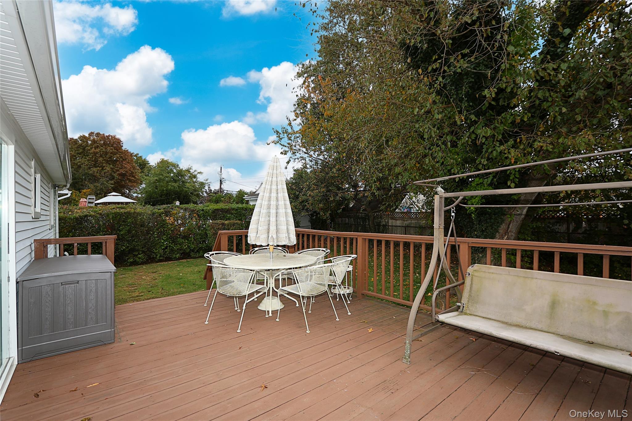6 Gerhard Road Plainview, NY 11803 - Photo 18 of 29 a view of a chair and table on the wooden floor