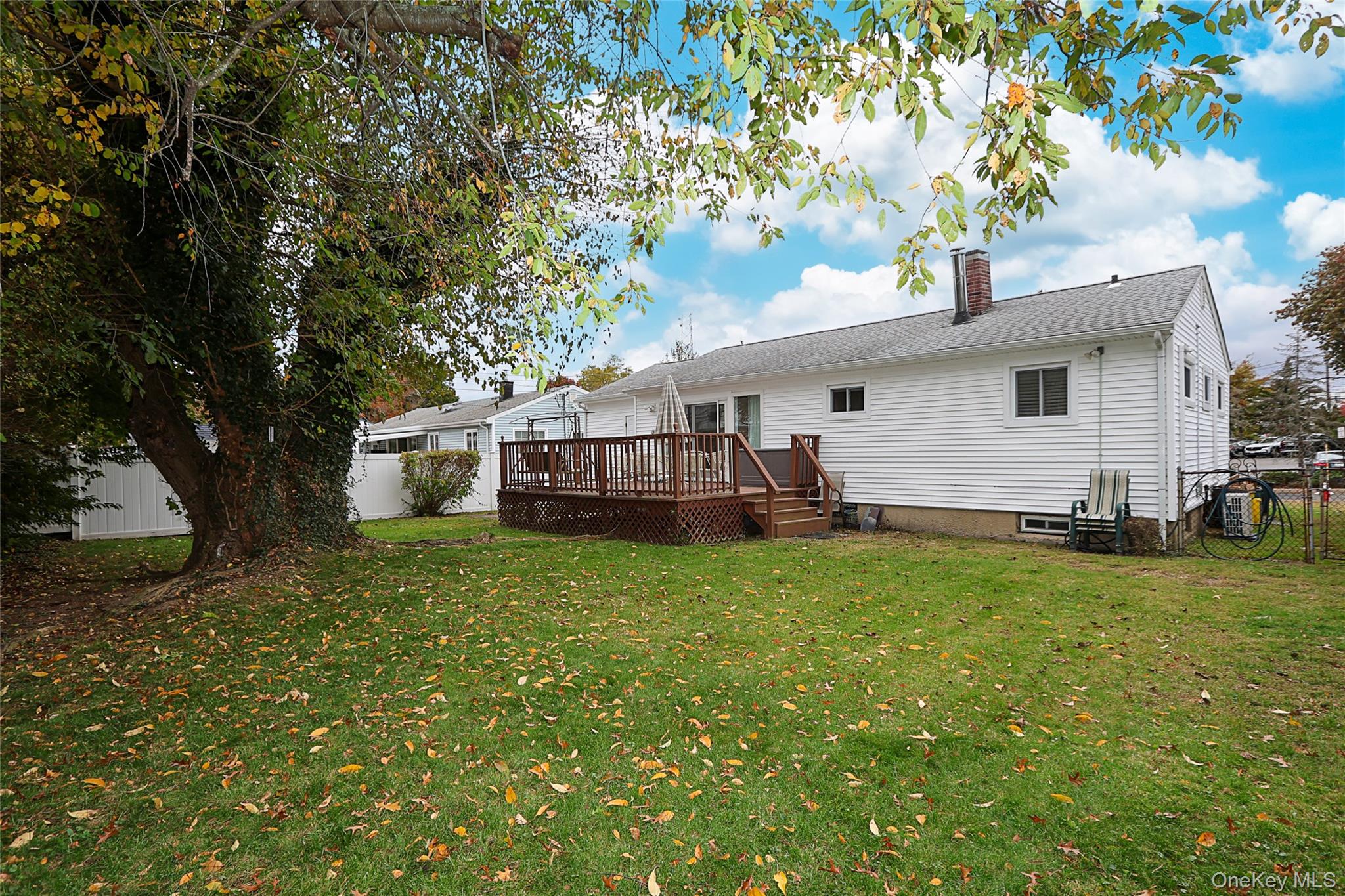 6 Gerhard Road Plainview, NY 11803 - Photo 24 of 29 a front view of a house with a garden