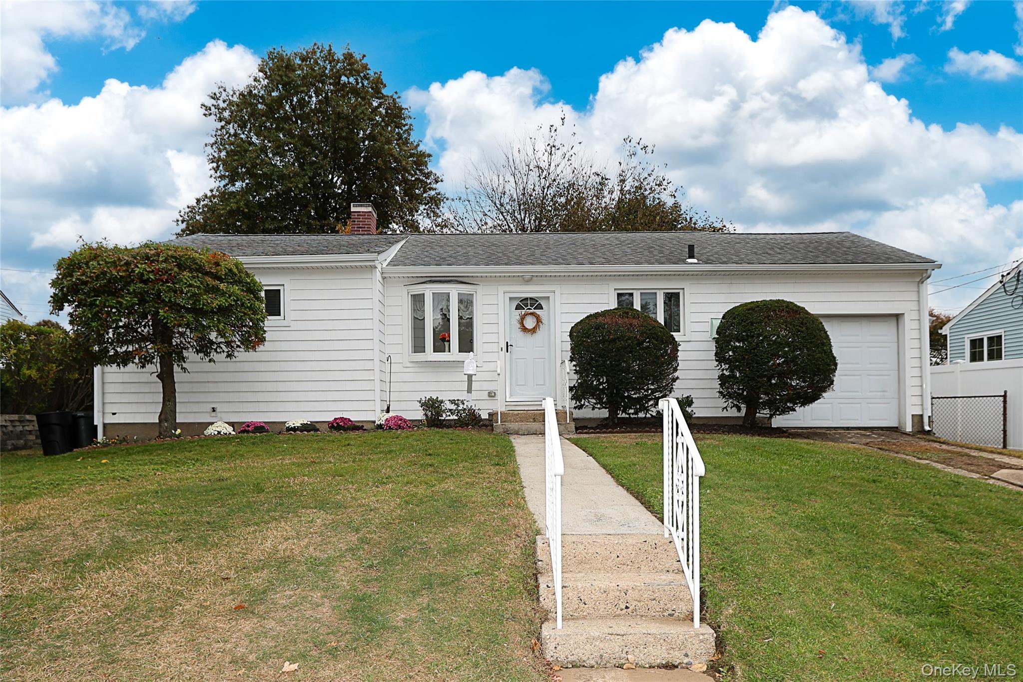 6 Gerhard Road Plainview, NY 11803 - Photo 26 of 29 a front view of a house with garden