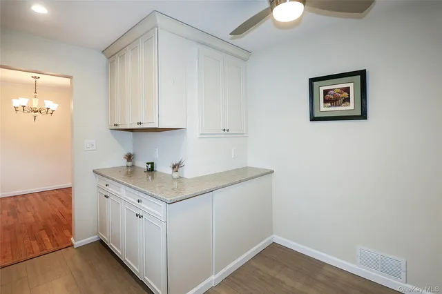 a view of cabinets with wooden floor