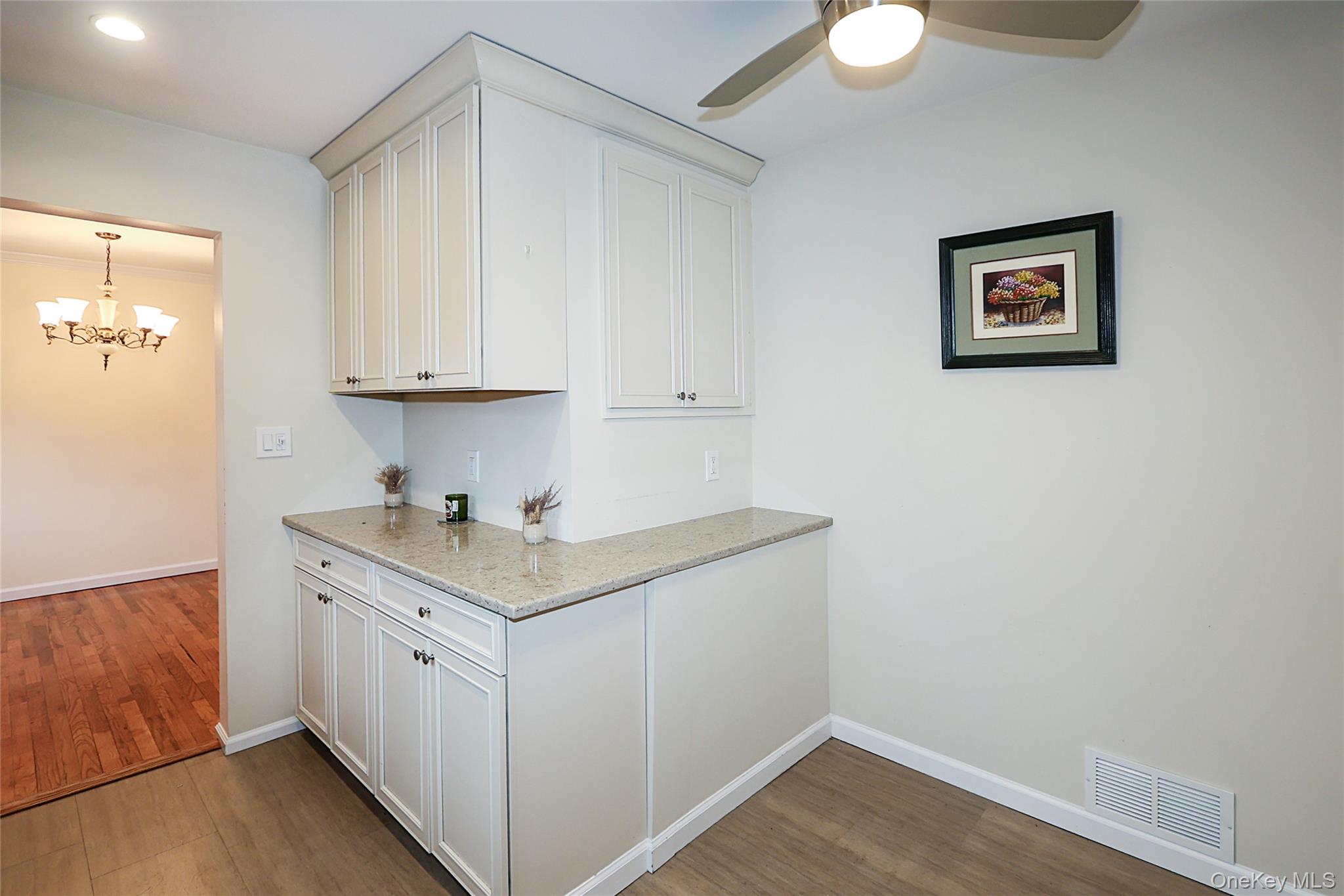 6 Gerhard Road Plainview, NY 11803 - Photo 6 of 29 a view of cabinets with wooden floor