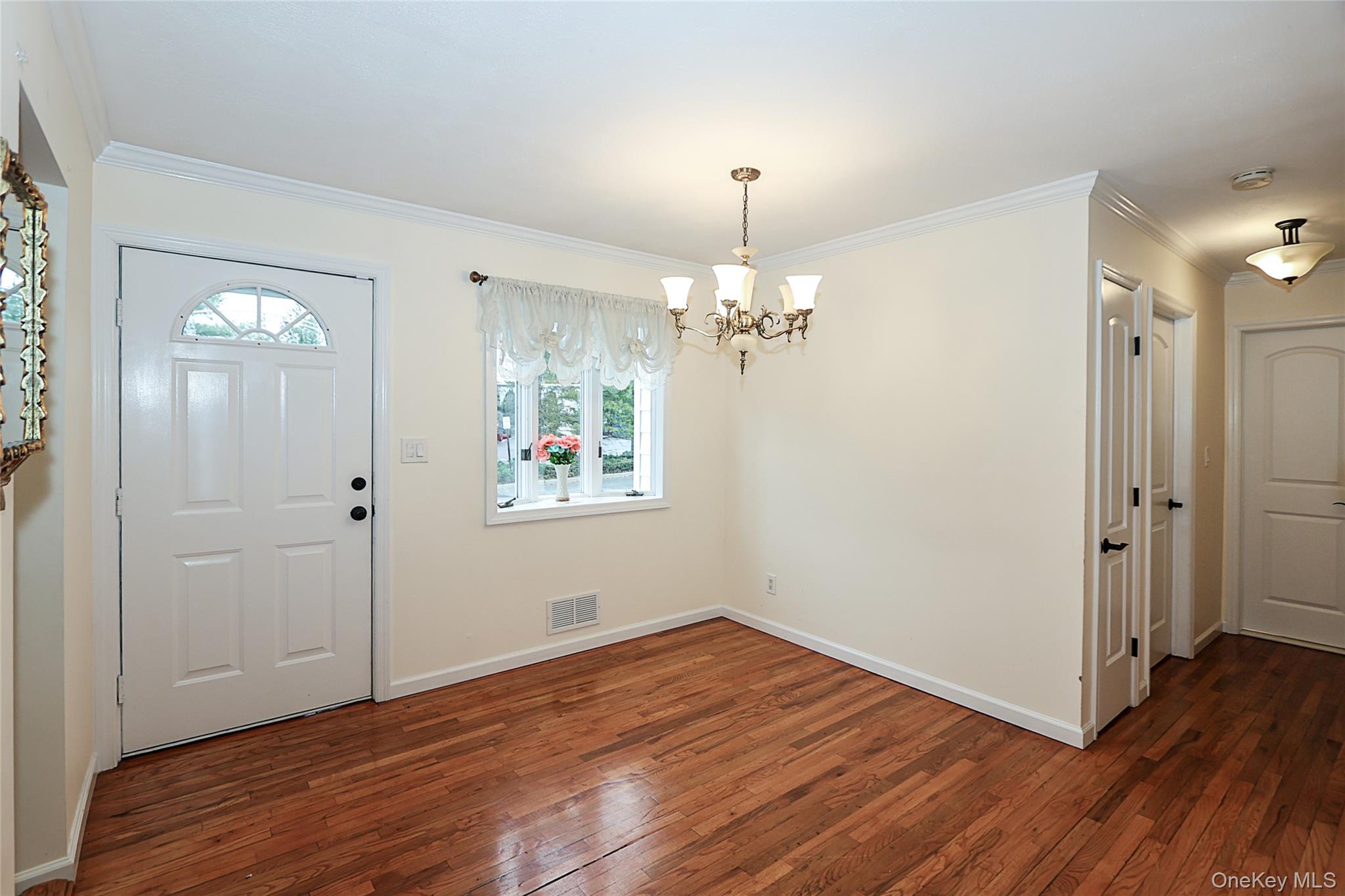 6 Gerhard Road Plainview, NY 11803 - Photo 7 of 29 wooden floor in an empty room with a window
