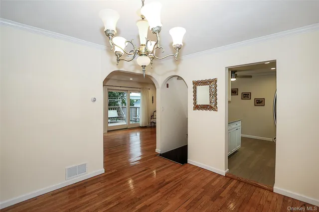 a view of a livingroom with wooden floor