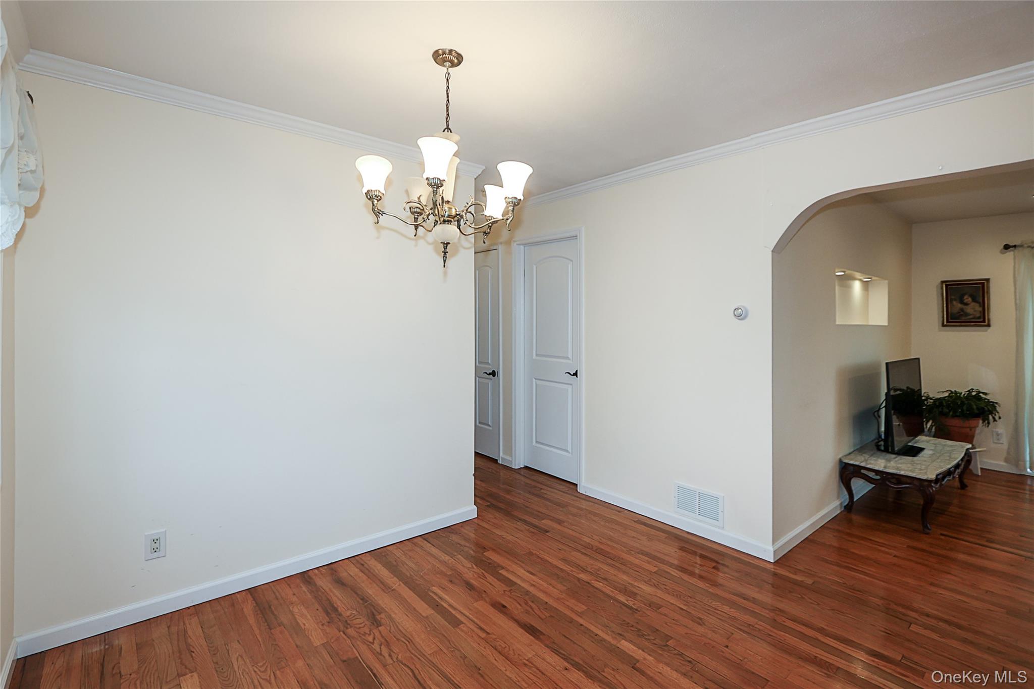 6 Gerhard Road Plainview, NY 11803 - Photo 10 of 29 a view of a livingroom with wooden floor and workspace