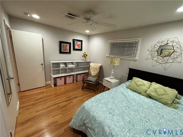 a bedroom with bed and a window