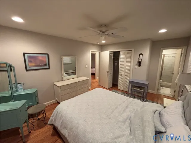 a bedroom with a bed a table and chair
