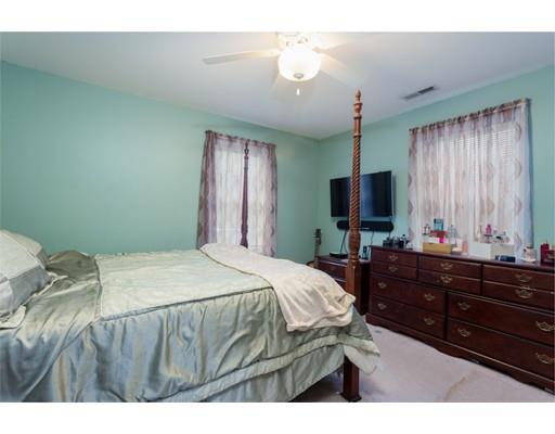 115 Eddy Street Springfield, MA 01104 - Photo 16 of 28 a bedroom with a bed window and a television