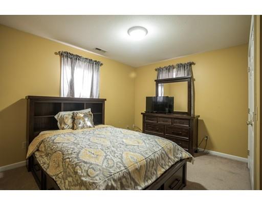 115 Eddy Street Springfield, MA 01104 - Photo 17 of 28 a bedroom with a bed and a dresser