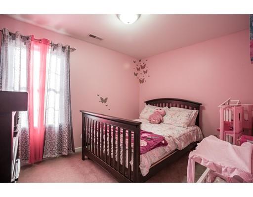 115 Eddy Street Springfield, MA 01104 - Photo 18 of 28 a bed room with a bed and a window