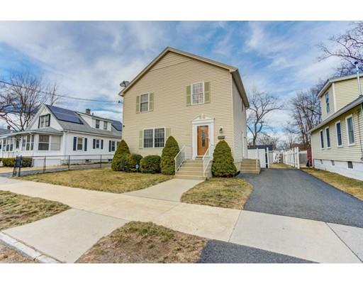 115 Eddy Street Springfield, MA 01104 - Photo 3 of 28 a front view of a house with a yard