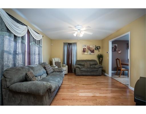115 Eddy Street Springfield, MA 01104 - Photo 6 of 28 a living room with furniture and a chandelier