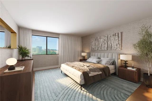 a bedroom with a bed and window