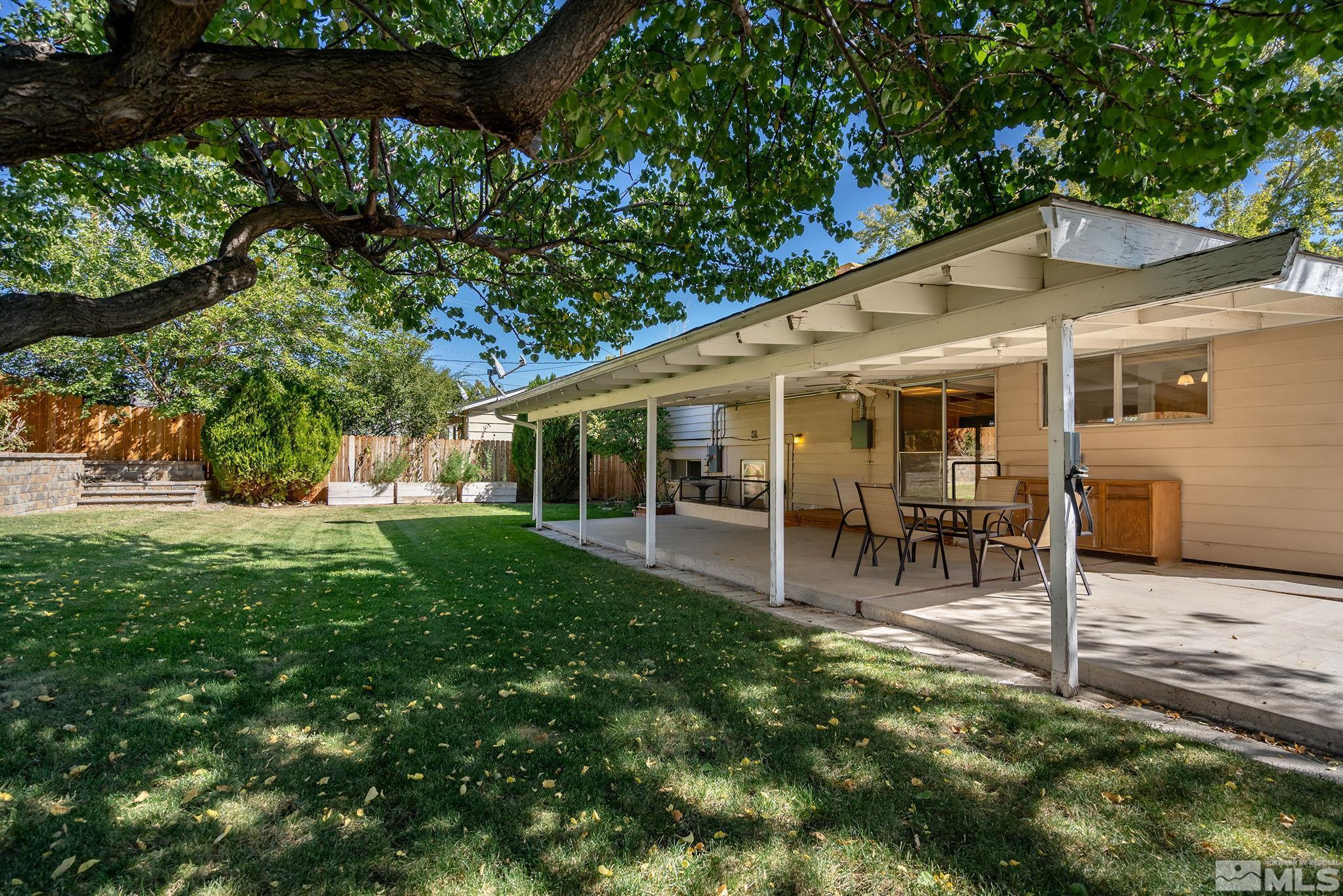 3495 Rauscher Drive Reno, NV 89503 - Photo 3 of 25 a view of a house with a backyard patio and sitting area