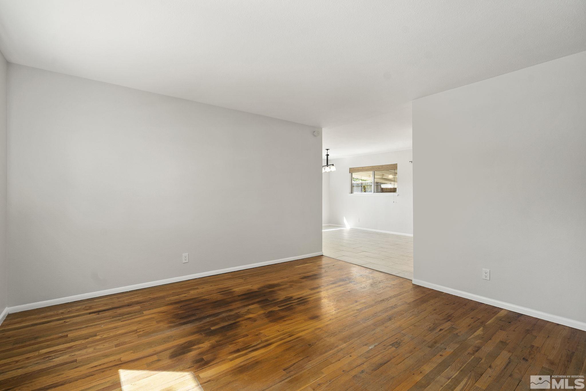 3495 Rauscher Drive Reno, NV 89503 - Photo 7 of 25 a view of an empty room and wooden floor