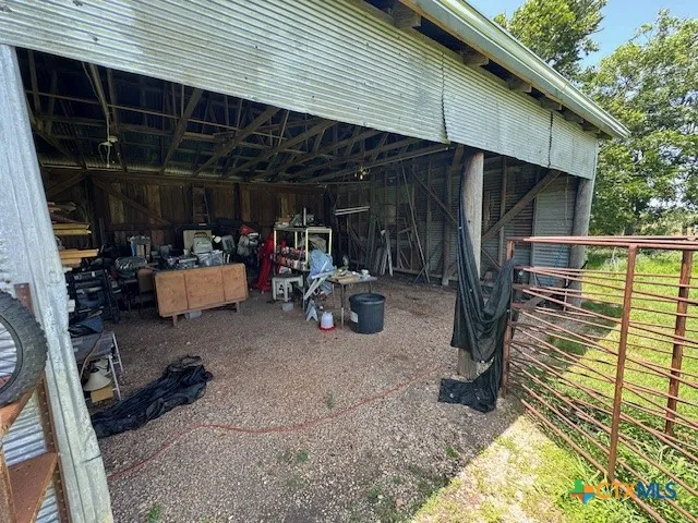 a view of a backyard with sitting area and furniture