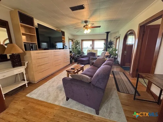 a living room with furniture and a flat screen tv