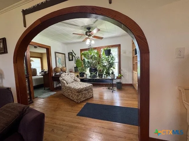 a living room with furniture and a large window