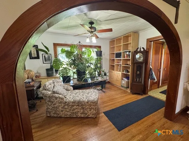 a living room with furniture and a large window