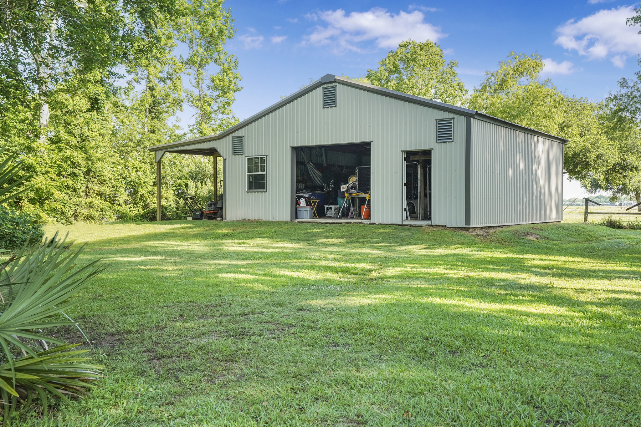 20547 Crosby Eastgate Road Crosby, TX 77532 - Photo 42 of 44 Barn, workshop, extra storage area and a lean-to