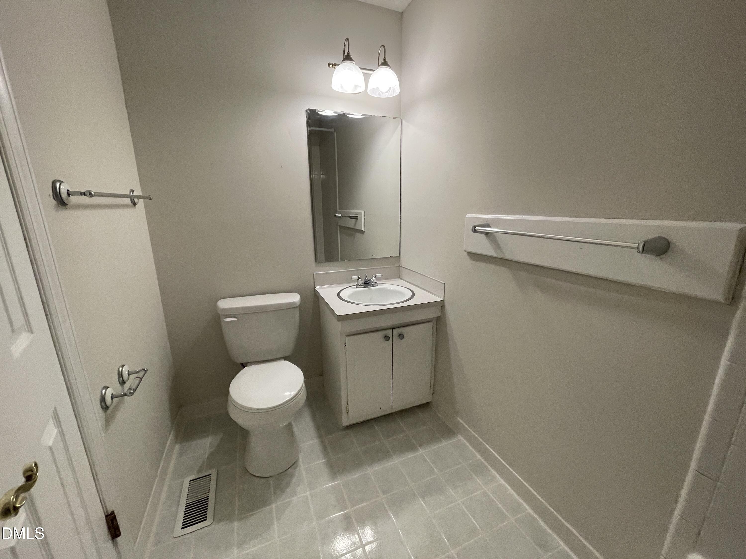 314 Brandywine Road Chapel Hill, NC 27516 - Photo 11 of 17 a bathroom with a sink a toilet and a mirror