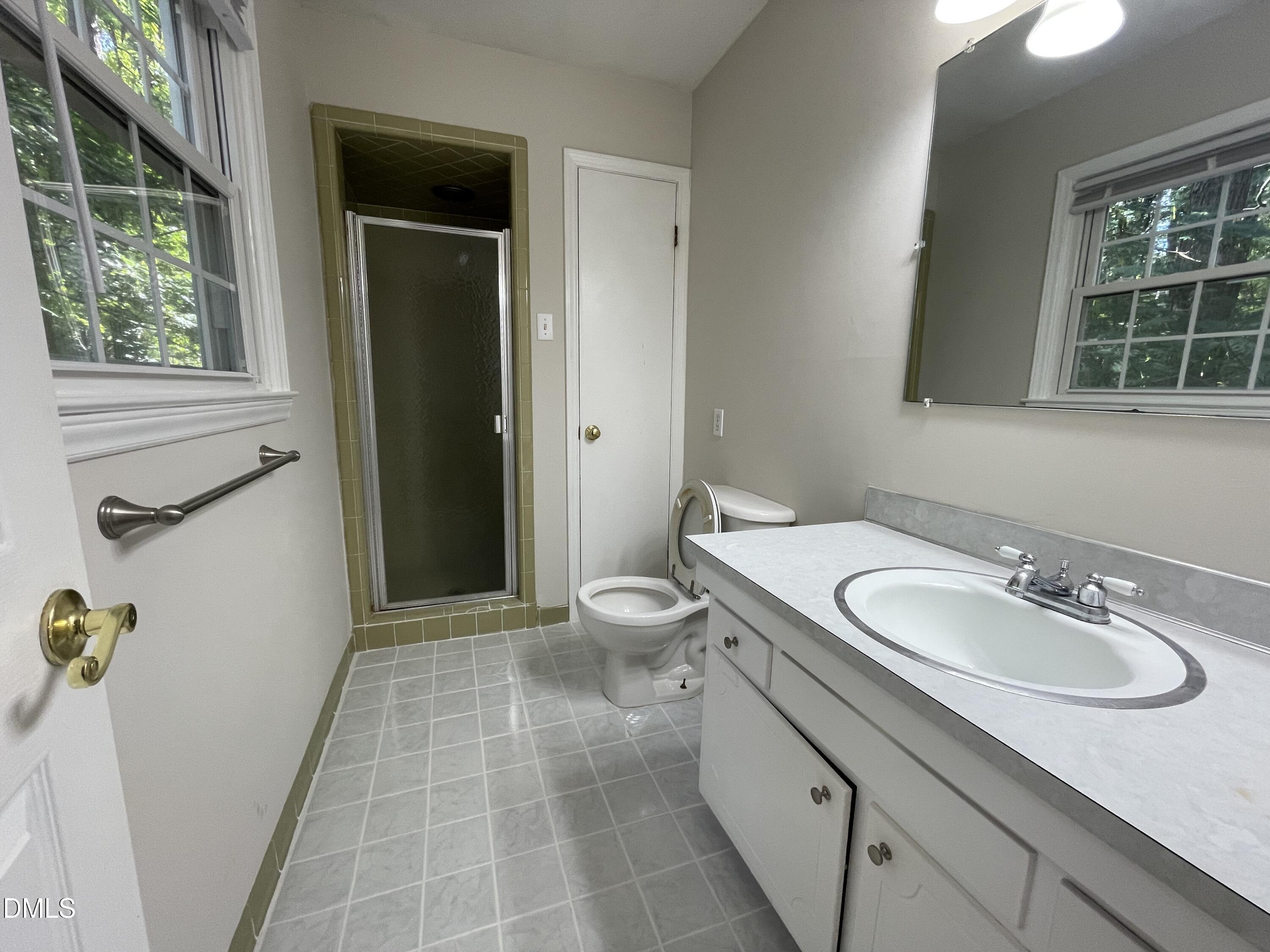 314 Brandywine Road Chapel Hill, NC 27516 - Photo 8 of 17 a bathroom with a granite countertop sink toilet and shower