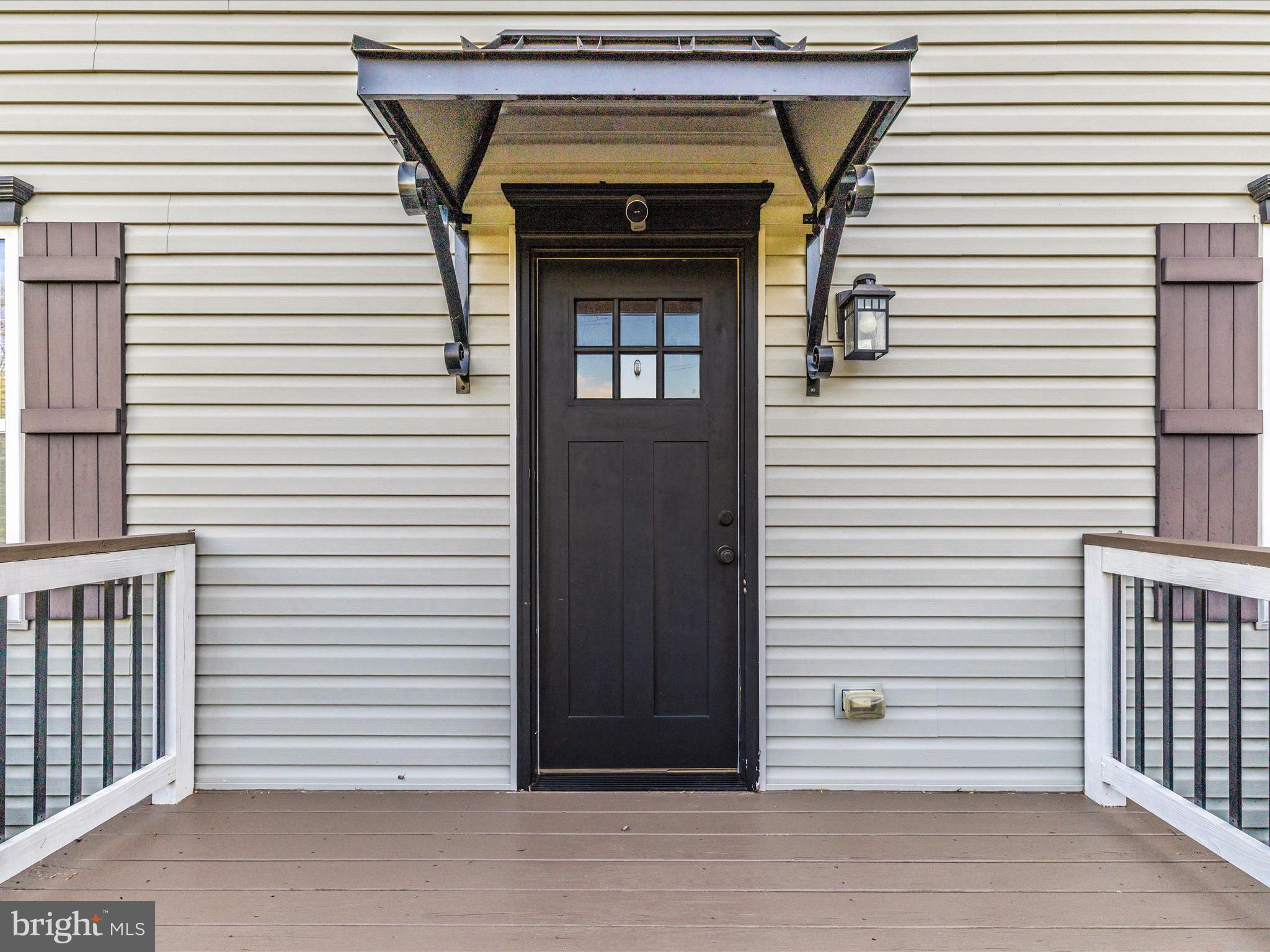 4533 Mountville Road Frederick, MD 21703 - Photo 2 of 70 a view of a porch with a door and a wooden floor
