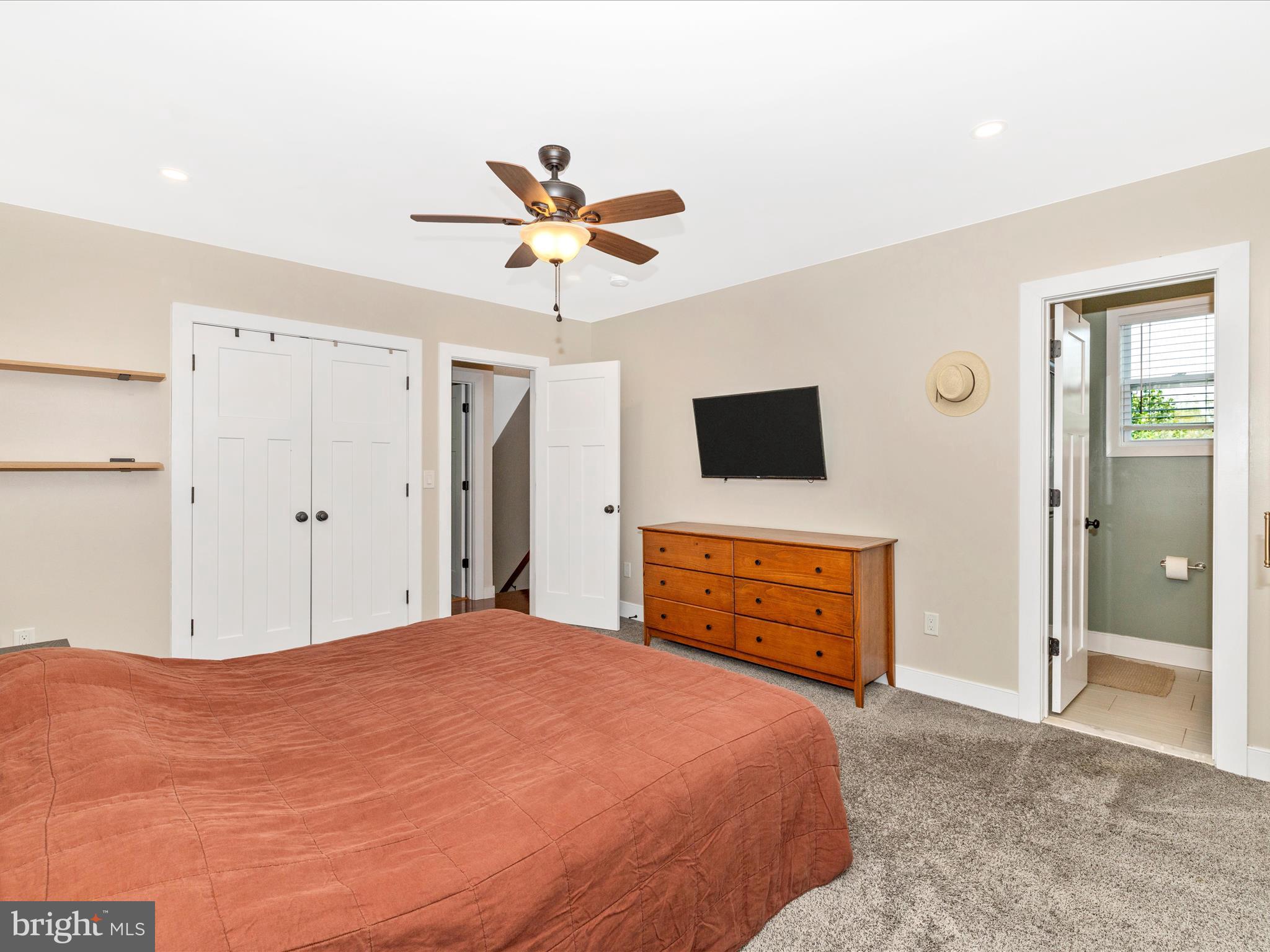4533 Mountville Road Frederick, MD 21703 - Photo 28 of 70 a bedroom with a bed and a flat screen tv
