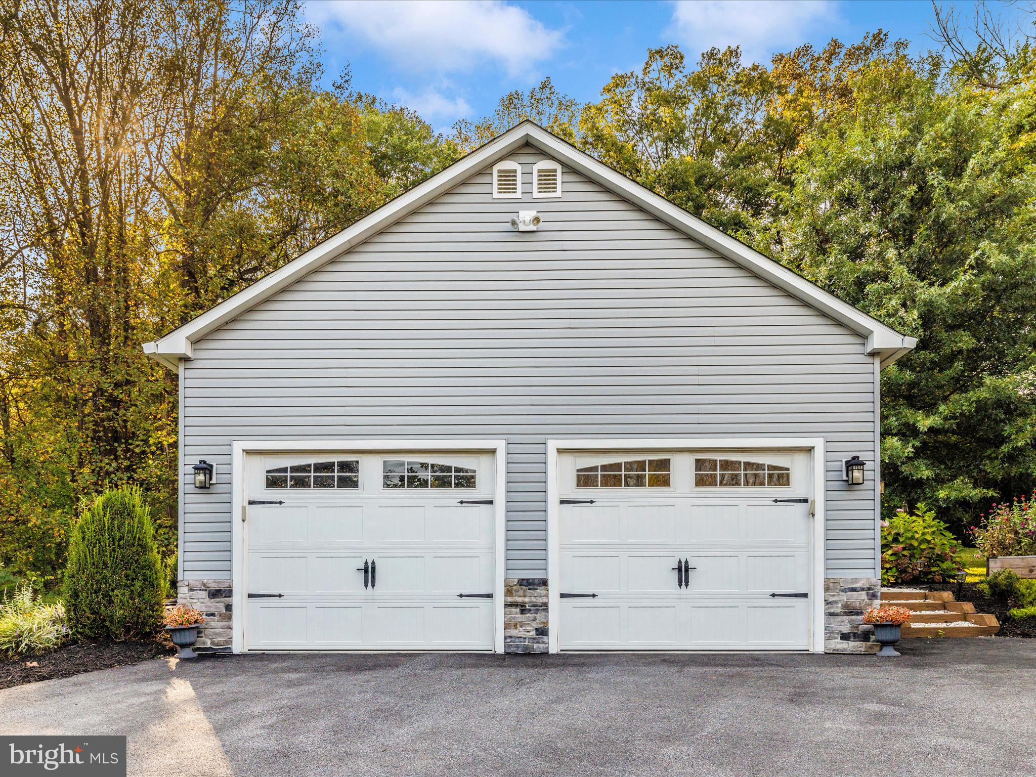 4533 Mountville Road Frederick, MD 21703 - Photo 49 of 70 a view of a white house with a small yard and parking space