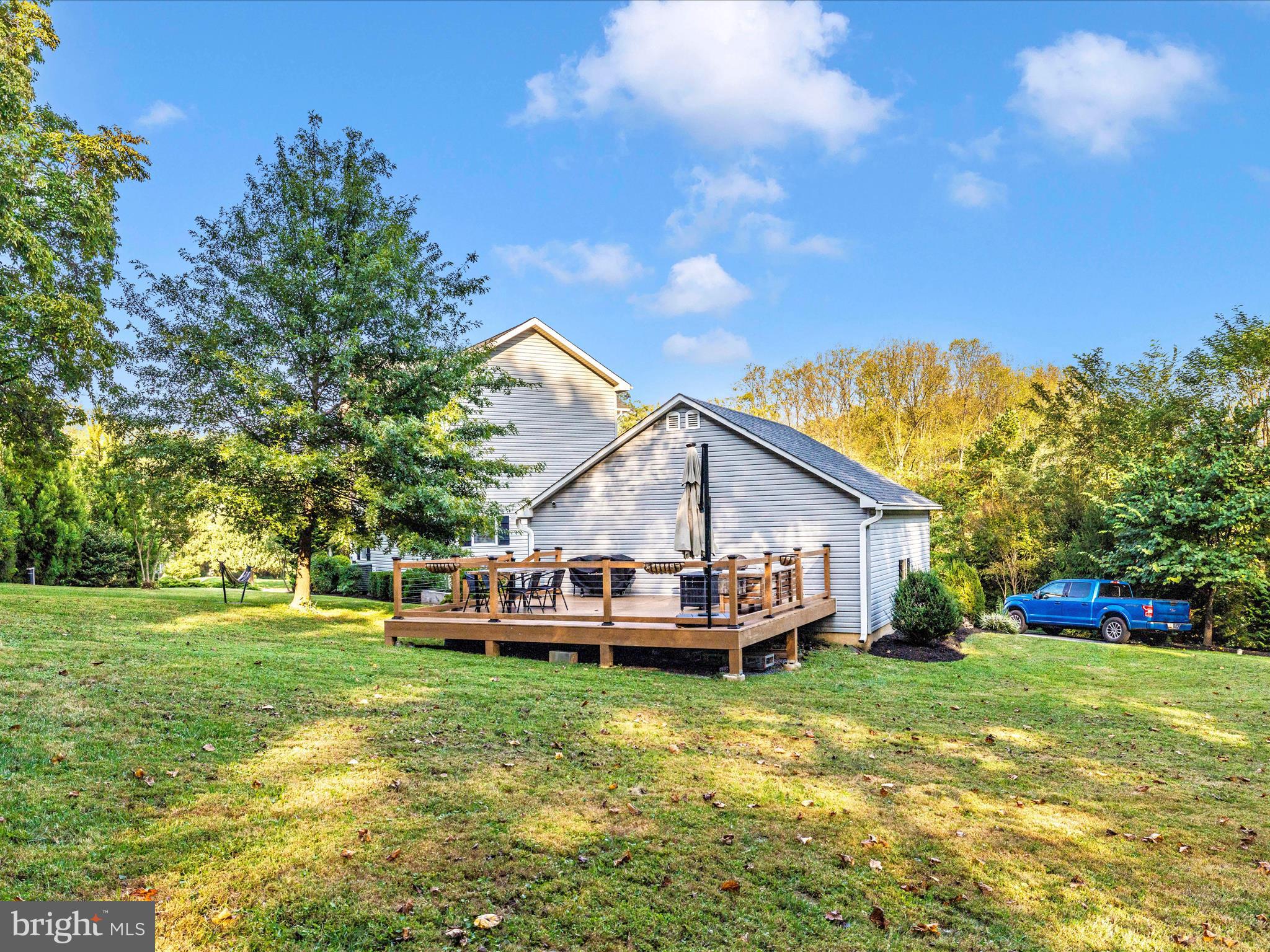 4533 Mountville Road Frederick, MD 21703 - Photo 52 of 70 a front view of a house with garden and trees