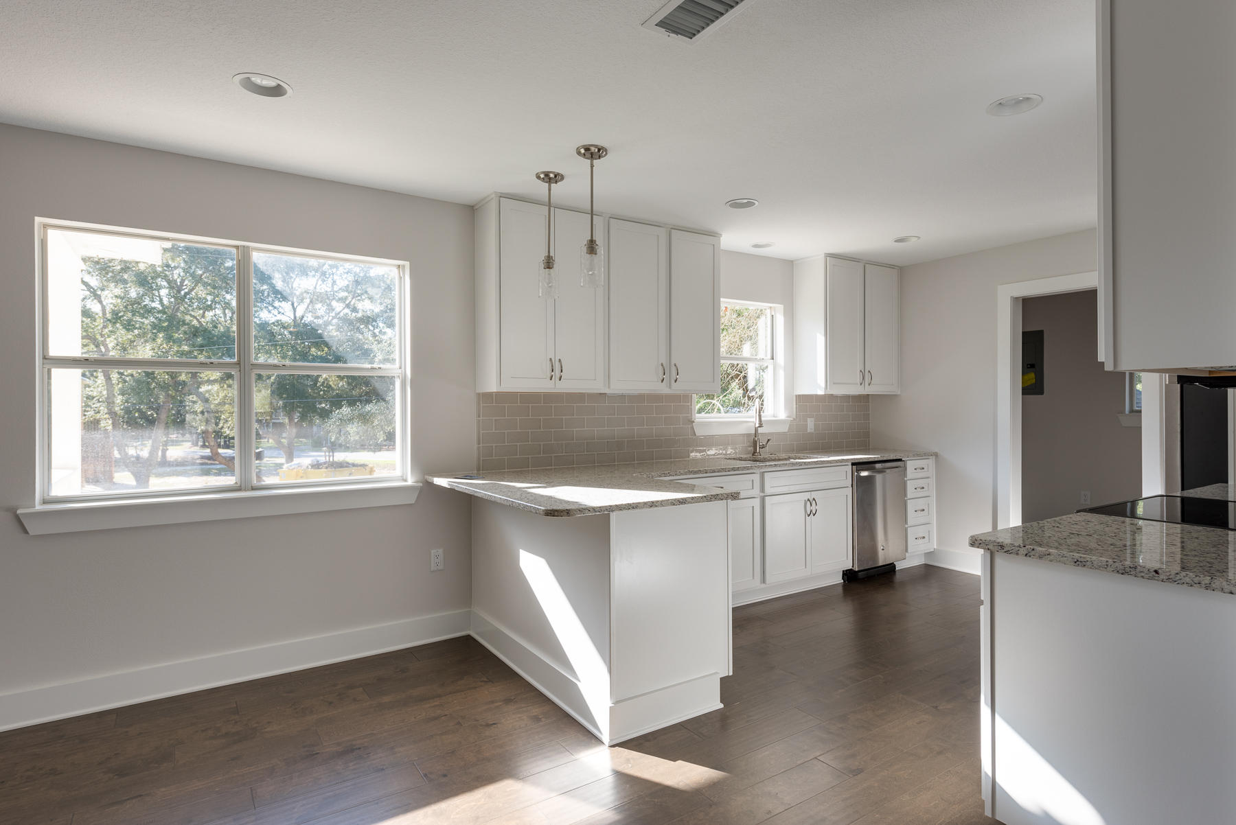 80 My Way Santa Rosa Beach, FL 32459 - Photo 13 of 33 a kitchen with granite countertop white cabinets and white appliances