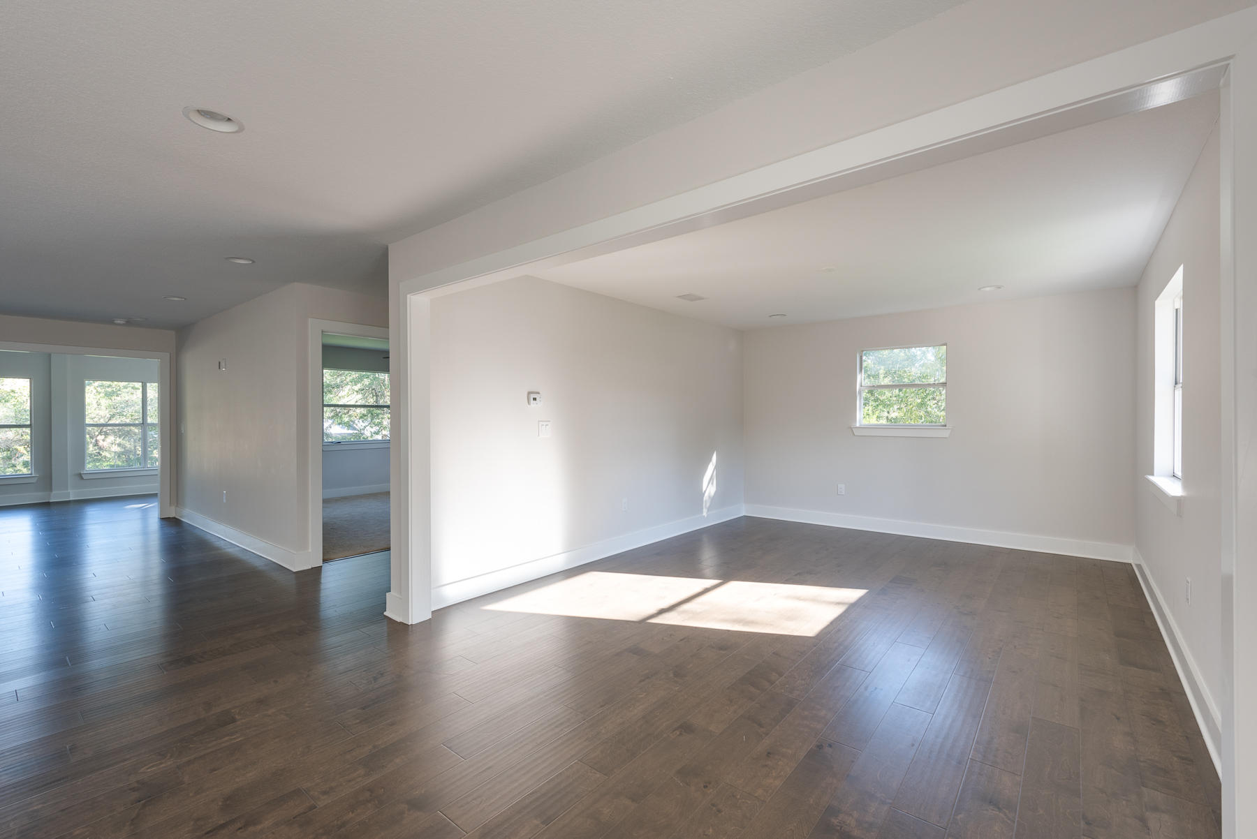 80 My Way Santa Rosa Beach, FL 32459 - Photo 15 of 33 an empty room with wooden floor and windows