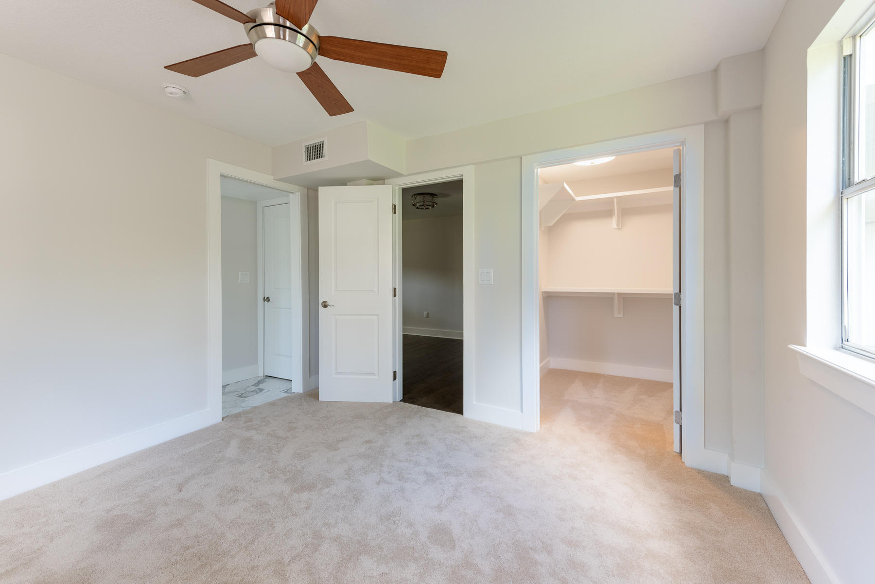 80 My Way Santa Rosa Beach, FL 32459 - Photo 29 of 33 an empty room with a ceiling fan and a window