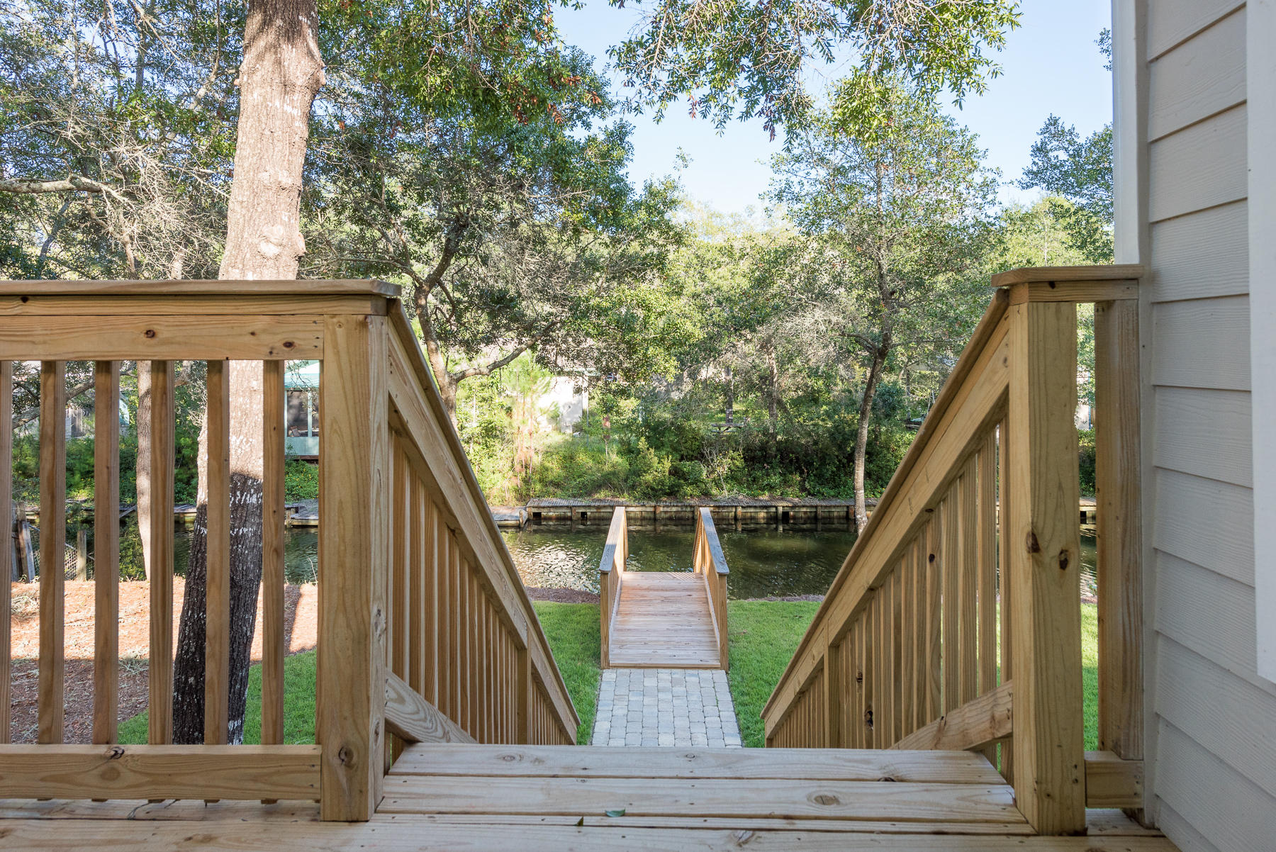 80 My Way Santa Rosa Beach, FL 32459 - Photo 8 of 33 a view of wooden balcony and trees