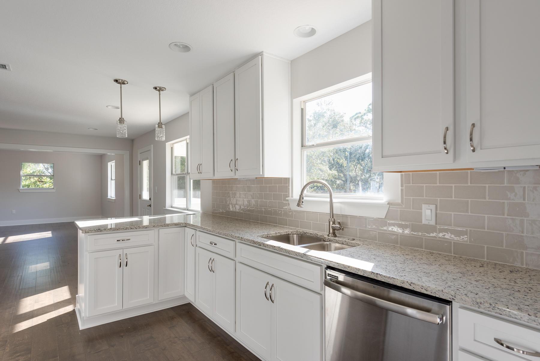 80 My Way Santa Rosa Beach, FL 32459 - Photo 10 of 33 a kitchen with granite countertop white cabinets white appliances and a sink